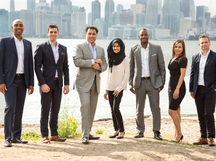 MorCan corporate team group portrait on Toronto Island beach with city skyline background