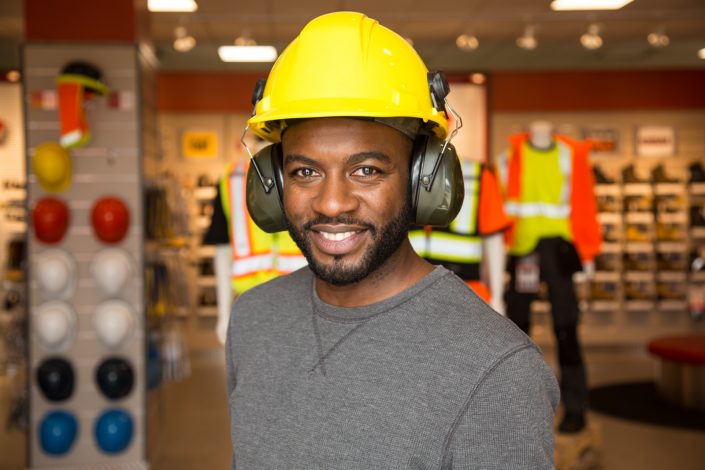 man in hard hat with earmuffs Mister Safety Shoes branding photography 0O7C4157