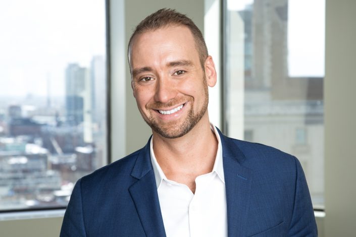 business smiling in blue suit for professional headshots toronto 0O7C3992