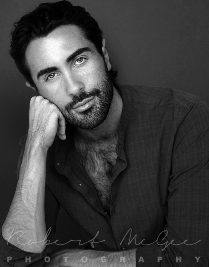 Headshot Portrait of Kyle head leaning on hand black and white Toronto studio-1