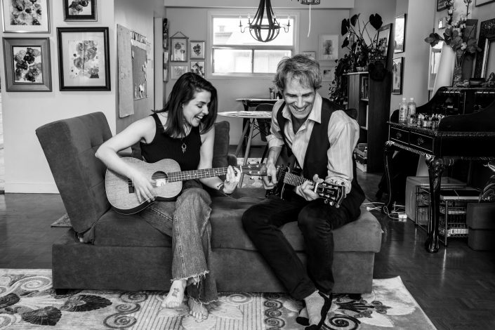 Wendy and Tim playing guitar laughing together in Wendy's studio 019A8080