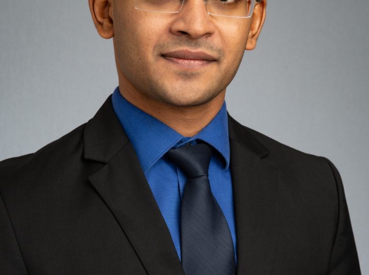 company wide, consistent look headshot for business website, vertical with grey backdrop 0O7C5806