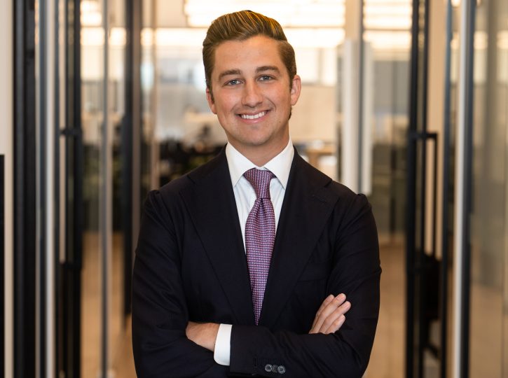 mortgage broker, smiling, wearing dark suit and tie, professional headshot in Toronto office